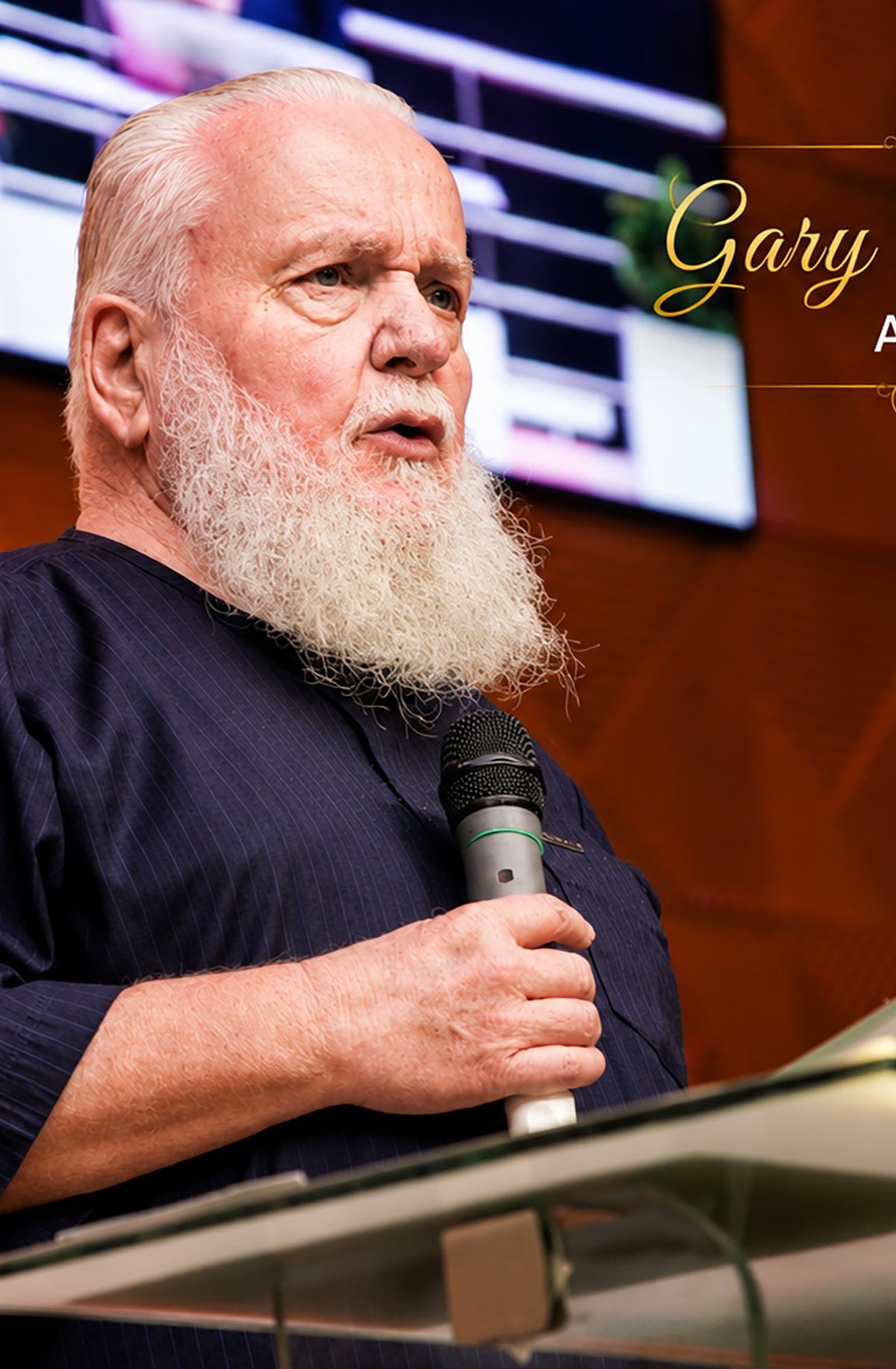 Rev. Prof. Gary S. Maxey preaching a call to holiness