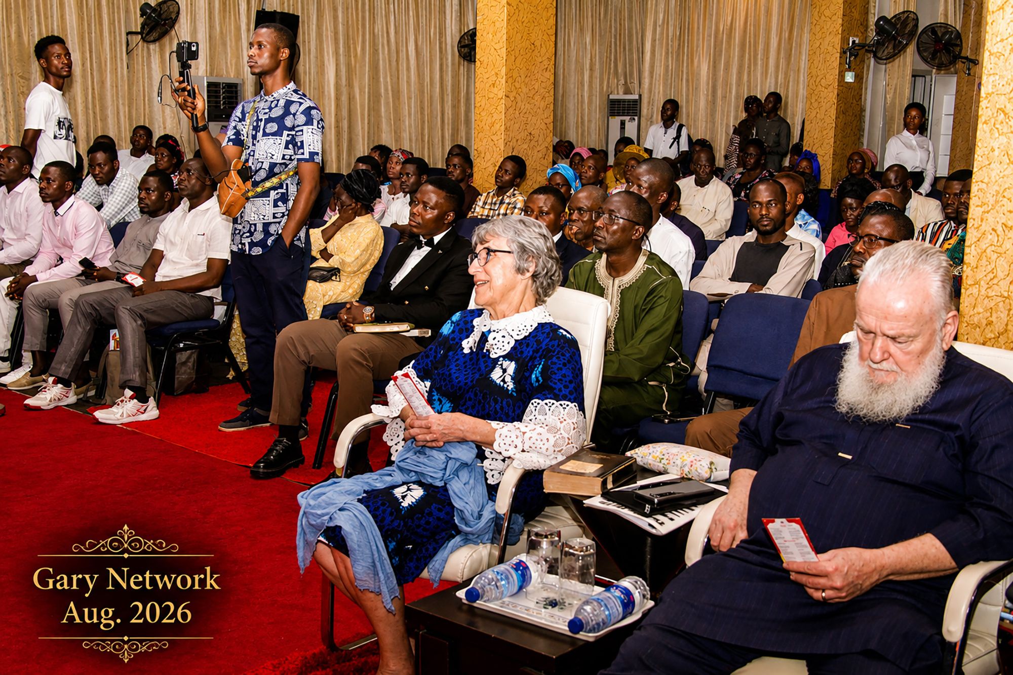 Believers gathered for a Gary S. Maxey Network session, with Rev. Prof. Gary and Dr. Emma Lou Maxey seated among the congregation